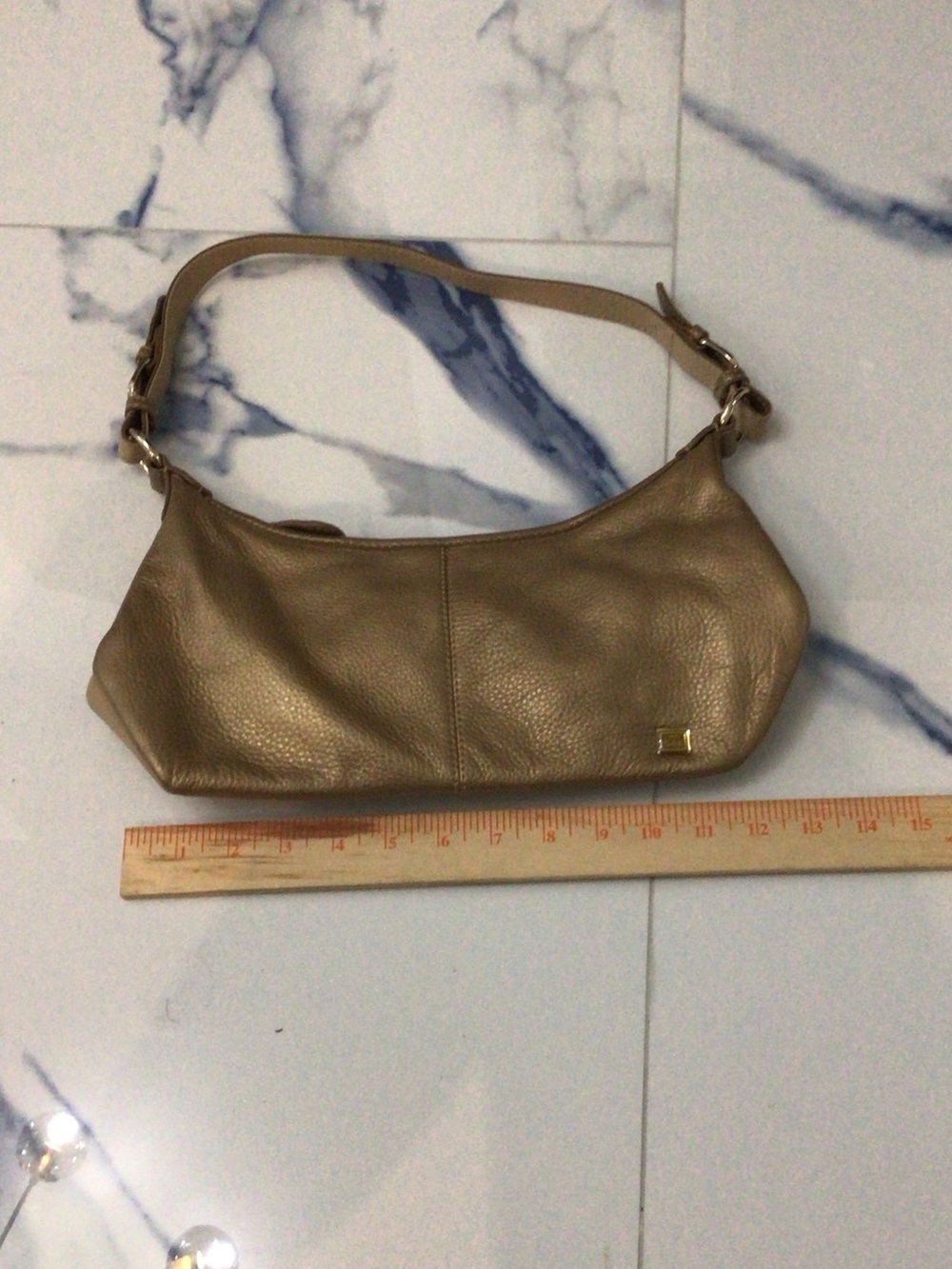The Sak taupe leather shoulder bag with gold accent